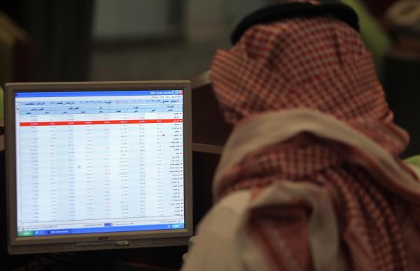 A Saudi trader monitors stocks at the Saudi Stock Exchange in Riyadh April 28, 2013. (Reuters/Faisal Al Nasser)