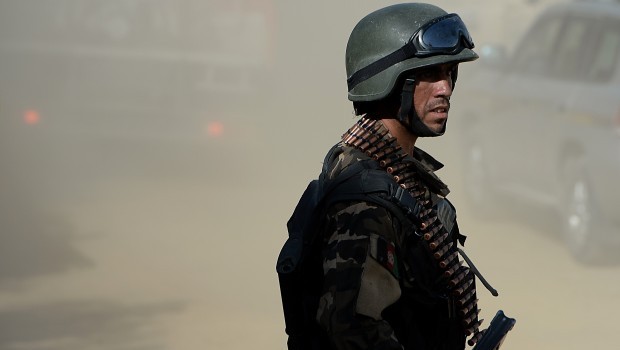 An Afghan security force keeps watch near the entrance gate of the Presidential palace in Kabul on June 25, 2013. Source: AFP Photo/Shah Marai