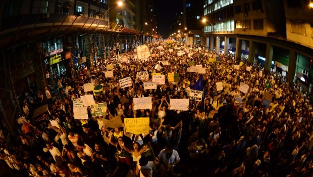 Thousands of demonstrators march in downtown Niteroi, near Rio de Janeiro, on June 19, 2013, during a protest against the USD 15 billion being spent on this month's Confederations Cup and the 2014 World Cup. Source: AFP Photo/Tasso Marcelo