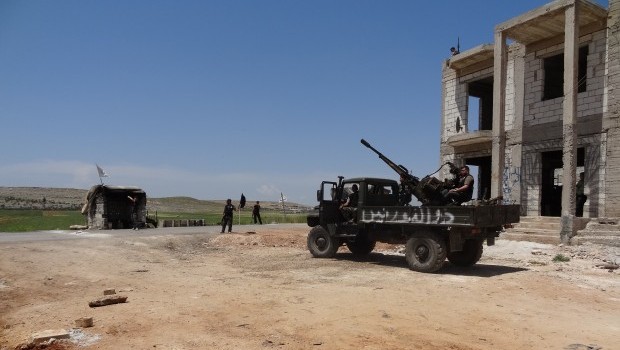 Fighters from the Free Syrian Army man a roadblock north of Aleppo, on June 5 2013 (AAA)