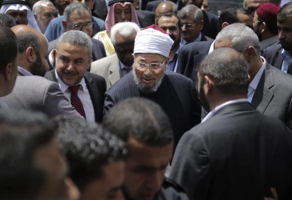 Egyptian chairman of the International Union for Muslim Scholars, Sheikh Yusuf Al-Qaradawi (C) during his visit to the Islamic University in Gaza City on May 9, 2013. (EPA/ALI ALI)