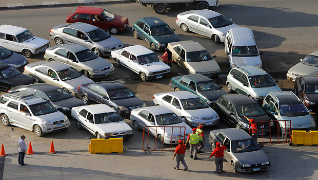 Egyptian drivers wait in long queues outside a gasoline station in Cairo, Egypt, Tuesday, June 25, 2013. (AP/Amr Nabil)