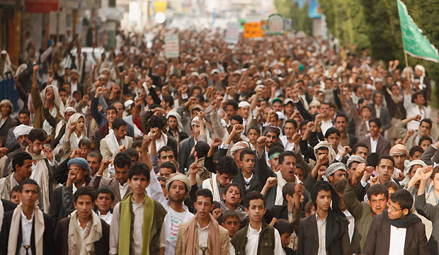 Supporters of the Shi'ite Houthi rebel group march during a demonstration against a military shake-up, carried out by Yemen's President Abd-Rabbu Mansour Hadi, in Sana'a onApril 12, 2013. (Reuters/Khaled Abdullah)
