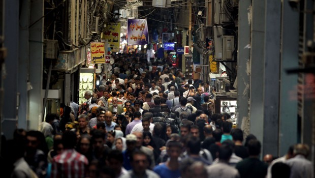 Iranians shop at the main old bazaar in Tehran on June 1, 2013. A televised debate on Irans sanctions-hit economy failed to introduce a frontrunner as the eight approved presidential candidates echoed each other on the main issues and refrained from making direct attacks. Source: AFP Photo/Atta Kenare