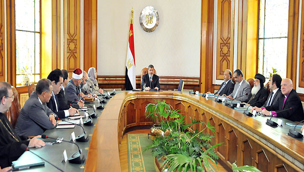 In this image released by the Egyptian Presidency, Egyptian President Mohammed Morsi, center, meets with politicians at the Presidential Palace in Cairo, Egypt, Monday, June 3, 2013. (AP Photo/Egyptian Presidency)