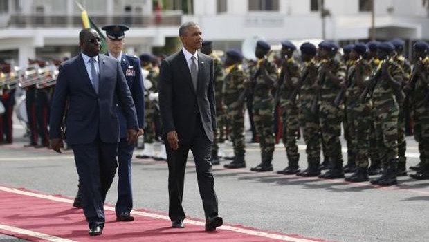 U.S. President Barack Obama walks with Senegal's President Macky Sall to Air Force One, as Obama departs Dakar, June 28, 2013. (REUTERS/Jason Reed)