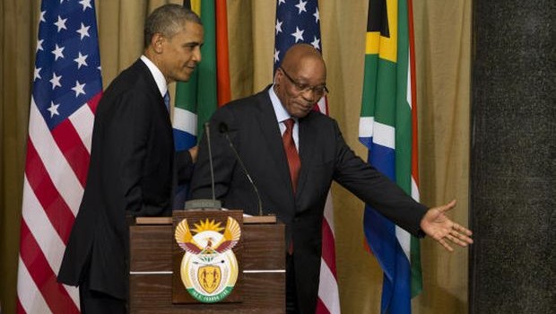U.S. President Barack Obama walks off after a news conference with South African President Jacob Zuma at the Union Building on Saturday, June 29, 2013, in Pretoria, South Africa. (AP Photo/Evan Vucci)