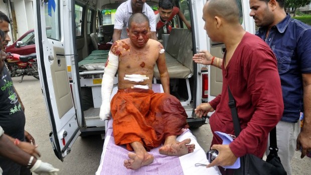 A Buddhist monk is carried on a stretcher for treatment after he was injured in an explosion in Bodhgaya, about 130 kilometers (80 miles) south of Patna, the capital of the eastern Indian state of Bihar, Sunday, July 7, 2013 (AP Photo/Manish Bhandari)
