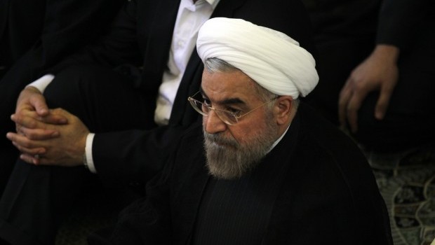 Iranian president-elect Hassan Rowhani (C) attends the weekly Friday prayer with Shi'ite Muslim worshippers during the Muslim fasting month of Ramadan on July 12, 2013 at the university of the Iranian capital, Tehran (AFP PHOTO/ATTA KENARE)