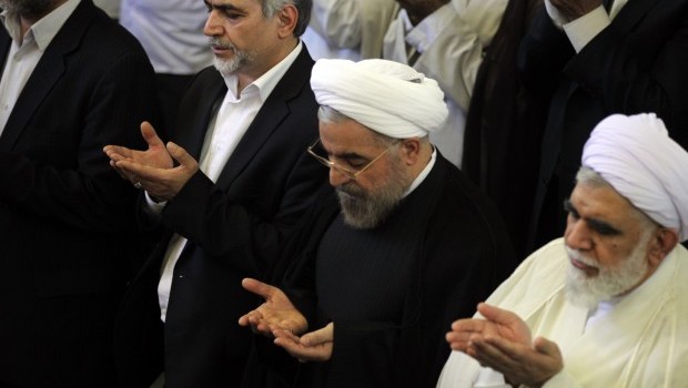 Iranian president-elect Hassan Rowhani (C) attends the weekly Friday prayer with Shiite Muslim worshippers during the Muslim fasting month of Ramadan on July 12, 2013 at the university of the Iranian capital, Tehran (AFP PHOTO/ATTA KENARE)