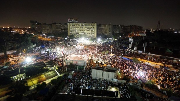 Members of the Muslim Brotherhood and supporters of deposed Egyptian President Mohamed Mursi gather at the Rabaa Adawiya square, where they are camping, in Cairo July 12, 2013. (Reuters/Mohamed Abd El Ghany)