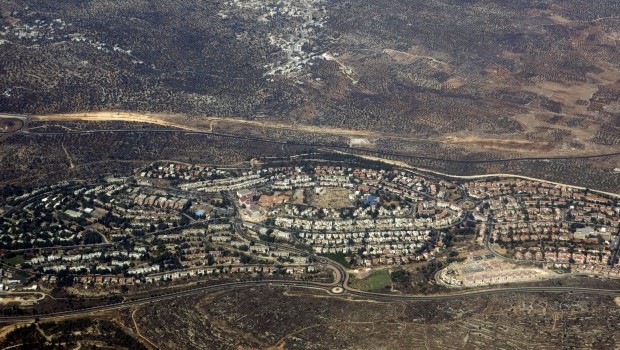 In this Sept. 20, 2010 aerial file photo, taken through the window of an airplane, the West Bank Jewish settlement of Ariel is seen. From 2014, Israeli authorities must guarantee that all EU funding and cooperation projects are conducted within Israel's pre-1967 border and not in east Jerusalem, the West Bank or Golan Heights. (AP Photo/Ariel Schalit, File)