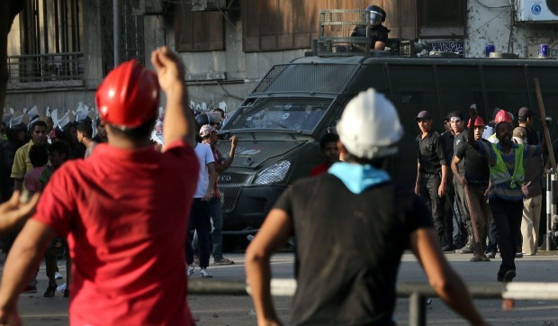 Supporters of ousted president Mohamed Morsi clash with police near the US embassy in Cairo, Egypt, 22 July 2013. (EPA)