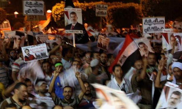 Egyptian supporters of Morsi during a rally supporting ousted president Mohamed Morsi in the streets of Nasr city in Cairo, Egypt, 31 July 2013. (EPA/Mohammed Saber)