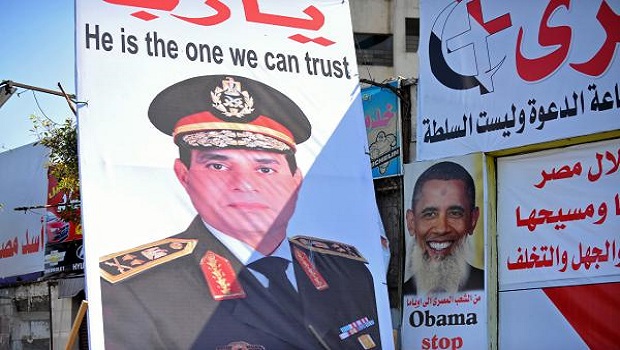 A picture taken July 29, 2013 shows posters on a street in Cairo of Egypt's army chief General Abdel-Fattah Al-Sisi. AFP PHOTO/FAYEZ NURELDINE