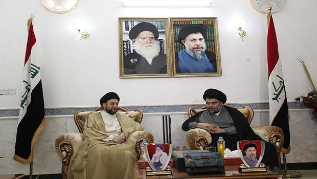 Ammar al-Hakim (L), leader of the Islamic Supreme Council of Iraq (ISCI), meets with Iraqi Shi'ite cleric Moqtada al-Sadr in Najaf, 160 km (100 miles) south of Baghdad, May 8, 2013. REUTERS/Haider Ala