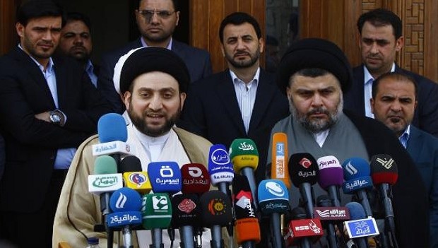 Ammar al-Hakim, leader of the Islamic Supreme Council of Iraq (ISCI), and Iraqi Shi'ite cleric Moqtada al-Sadr, hold a news conference in Najaf, 160 km (100 miles) south of Baghdad, May 8, 2013. REUTERS/Haider Ala