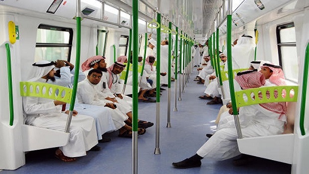 A picture taken on November 2, 2010 shows Saudi Arabian men riding on the newly-opened Holy Sites metro light rail in the western Saudi city of Mecca. Saudi Arabia has granted three foreign consortiums contracts to build a Riyadh metro, a project worth $22.5 billion. AFP PHOTO/AMER HILABI