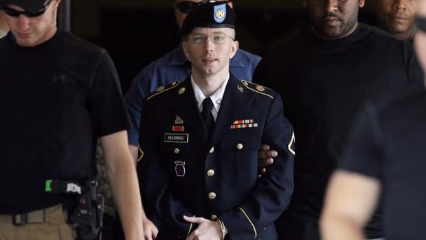 In this July 30, 2013 photo, Army Pfc. Bradley Manning is escorted out of a courthouse in Fort Meade, Md.  (AP Photo/Patrick Semansky)