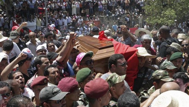 Tunisians carry the coffin of Tunisian opposition politician Mohammed Brahmi during his funeral at Jallez Cemetery in Tunis, Saturday July, 27, 2013. (AP Photo/Amine Landoulsi)