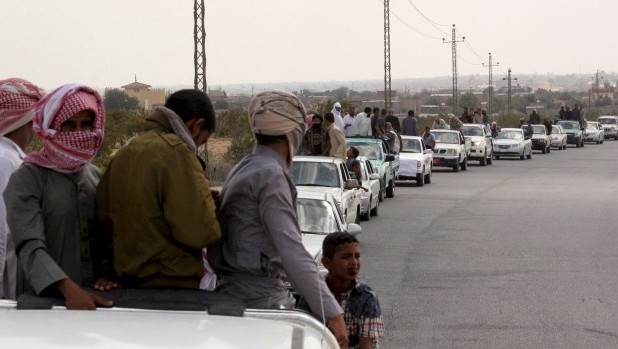 A funeral convoy carrying the bodies of four Islamist militants drives through Sheikh Zuweid, in the north of the Sinai peninsula, August 10, 2013. (Retuers/Stringer)