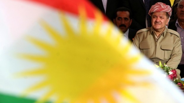 Massoud Barzani, the president of the Kurdish regional government in northern Iraq, is seen sitting behind a Kurdish flag prior to speaking to supporters in the northern Iraqi Kurdish city of Arbil on May 26, 2013. (AFP Photo / Safin Hamed)