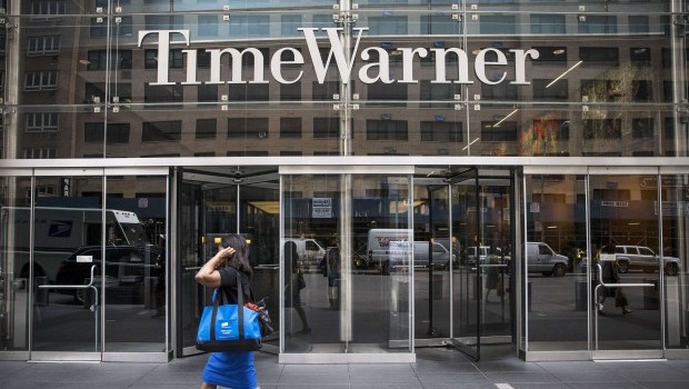 A woman walks past the entrance to the Time Warner center on August 7, 2013 in New York City. (Andrew Burton/Getty Images/AFP)