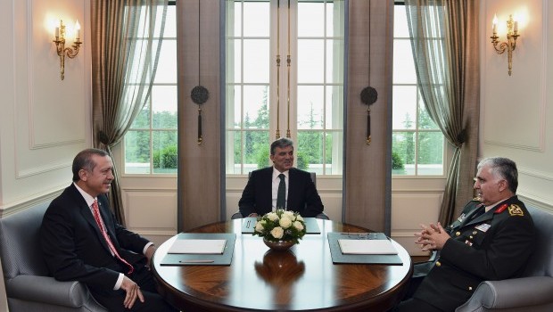 In this photo released by the Turkish Presidency Press Office, Turkish President Abdullah Gul, center, speaks with Prime Minister Recep Tayyip Erdogan, left, and Chief of Staff Gen. Necdet Ozel during a meeting in Ankara, Turkey, Thursday, July 18, 2013. (AP Photo/Mehmet Demirci)