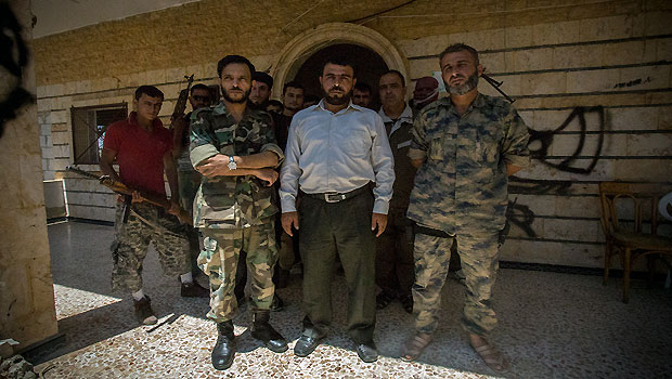 Abu Khalid (centre) with the Euphrates Knights. (Asharq Al-Awsat/Hannah Lucinda Smith)
