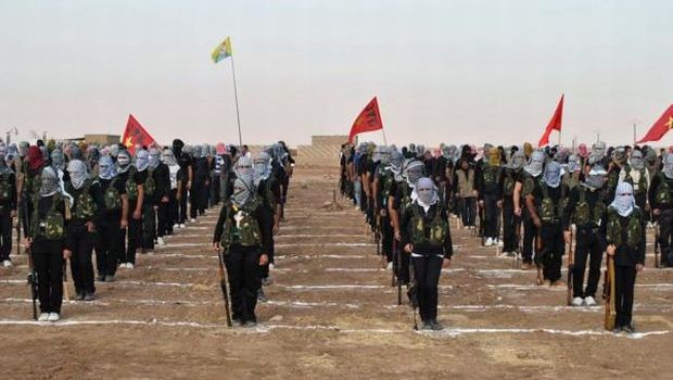 (FILES) A picture taken on July 18, 2013 shows Kurdish opposition fighters attending a ceremony the northern Syrian border village of al Qamishli. Jihadist groups linked to Al-Qaeda have taken hostage around 200 Kurdish civilians after violent clashes with Kurdish fighters in two villages of eastern Syria, a monitoring group said on July 31, 2013. (AFP PHOTO/STR)