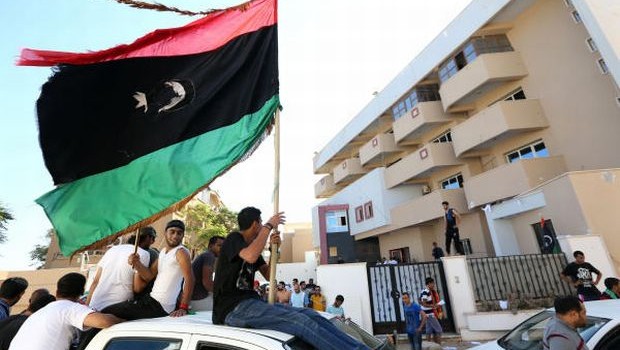 Libyan protesters gather outside the offices of Muslim Brotherhood-backed Party of Justice and Construction, in the Libyan capital Tripoli on July 27, 2013. (MAHMUD TURKIA/AFP PHOTO)