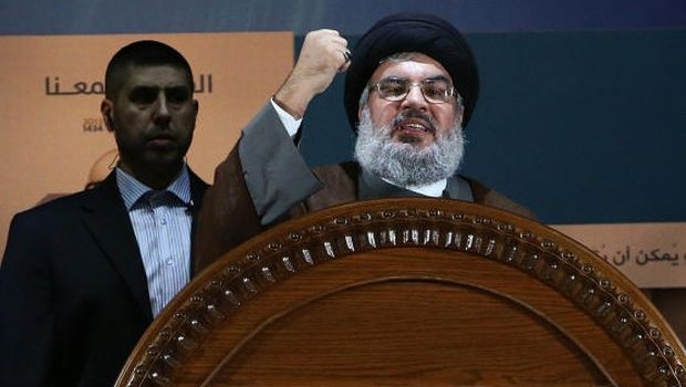 In this August 2, 2013, file photo, Hezbollah leader Sheikh Hassan Nasrallah speaks during a rally to mark Jerusalem, or Al-Quds, Day in the southern suburb of Beirut, Lebanon. (AP Photo/Hussein Malla, File)