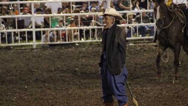 The performer wearing a President Barack Obama mask. (AP Photo/Jameson Hsieh)