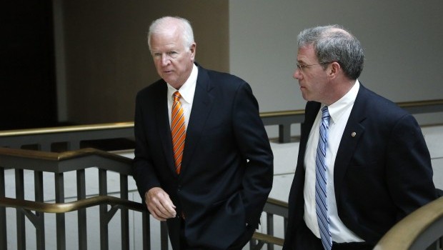 US Senator Saxby Chambliss (left), vice chairman of the Senate Select Committee on Intelligence, and Senator Jeffrey Chiesa depart after a full-Senate briefing at the US Capitol in Washington, June 13, 2013. (Reuters/Jonathan Ernst)