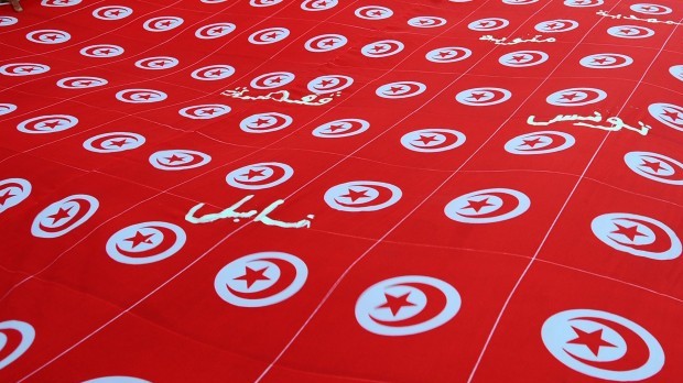 Tunisian national flags are seen during a demonstration in Tunis, the capital of Tunisia, in this September 7, 2013, file photo. (AP Photo/Hassene Didri)