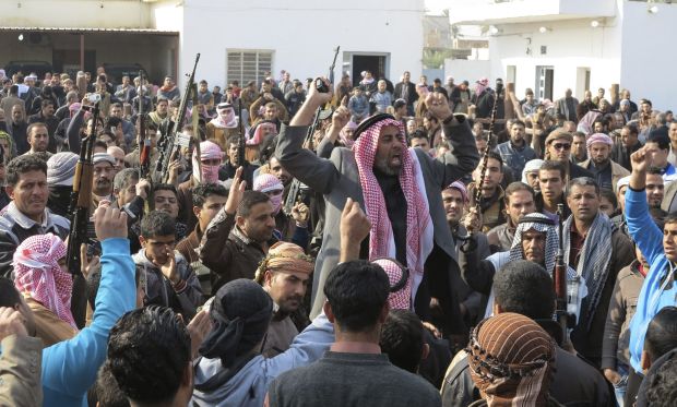 Residents gather to protest near the house of prominent Sunni Muslim lawmaker Ahmed al-Alwani, in the centre of Ramadi, on December 29, 2013. (Reuters/Ali al-Mashhadani)