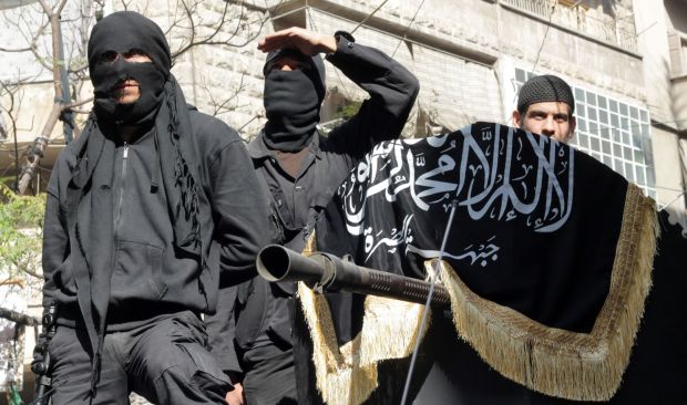 A picture taken on October 25, 2013 shows members of jihadist group Al-Nusra Front taking part in a parade calling for the establishment of an Islamic state in Syria, at the Bustan al-Qasr neighbourhood of Aleppo.  (AFP/Karam Al-Masri)