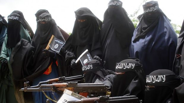 Somali women carry weapons during a demonstration organized by the Islamist Al-Shabab group which is fighting the Somali government in Mogadishu, July 5, 2010. (AFP Photo/Abdurashid Abikar)