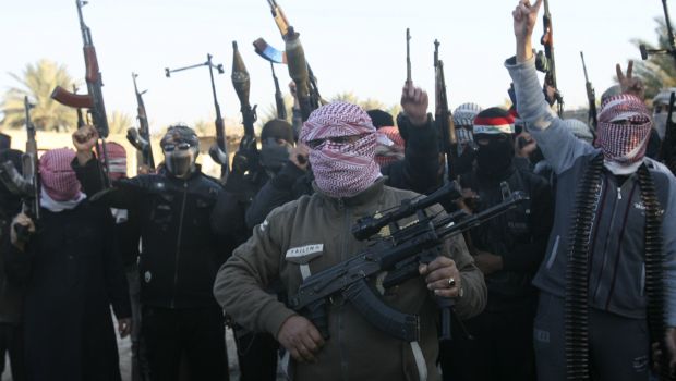 Masked Sunni gunmen chant slogans during a protest against Iraq's Shi'ite-led government, demanding that the Iraqi army not try to enter the city, in Falluja on January 7, 2014. (REUTERS/Stringer