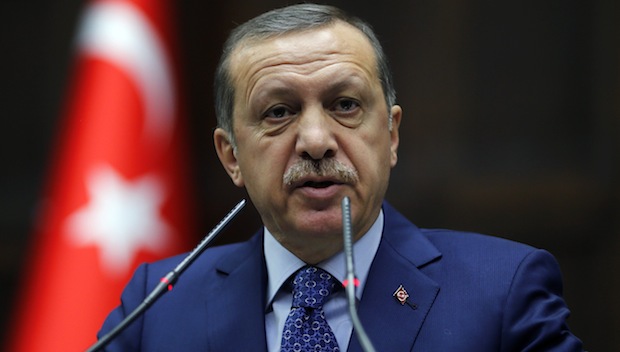 Turkey's Prime Minister Recep Tayyip Erdoğan addresses members of parliament from his ruling Justice and Development Party during a meeting at the Turkish parliament in Ankara on February 18, 2014. (REUTERS/Umit Bektas)