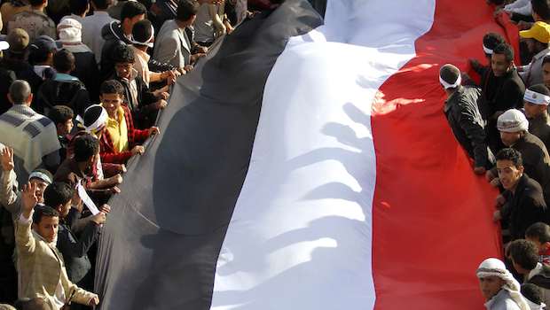 File photo of protesters holding the Yemeni flag. (REUTERS/Mohamed al-Sayagh)