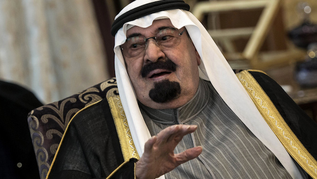 Saudi Arabia's King Abdullah speaks with US Secretary of State John Kerry before their meeting in Rawdat Khurayim, a secluded royal hunting retreat in Saudi Arabia on January 5, 2014.  (AP Photo/Brendan Smialowsk)