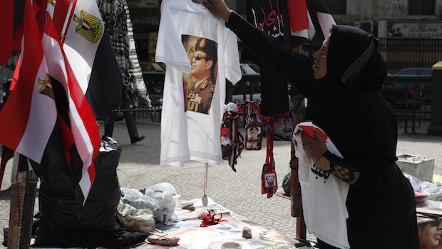 A vendor hangs a T-shirt with a picture of Field Marshal Abdel-Fattah El-Sisi on a tree in Tahrir square in Cairo on February 22, 2014. (REUTERS/Asmaa Waguih)