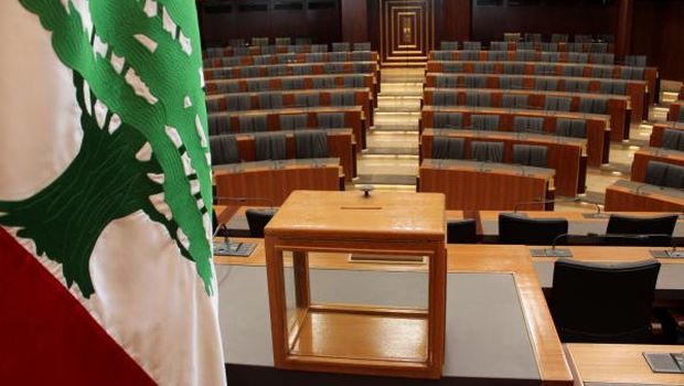 A ballot box sits on a table next to the national flag at the Lebanese Parliament in the capital Beirut on April 22, 2014 ahead of the country’s presidential election. (AFP Photo/STR)