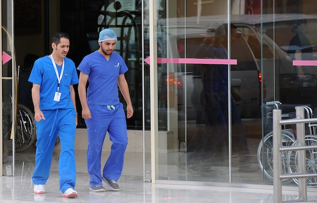 Saudi medical staff leave the emergency department at a hospital in the center of the Saudi capital Riyadh on April 8, 2014.</nr>(AFP PHOTO/FAYEZ NURELDINE)