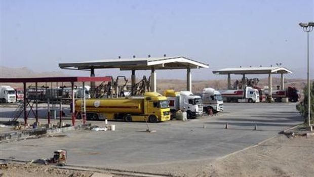 Tanker trucks wait to be loaded at Taq Taq oilfield in Erbil on September 5, 2012. (Reuters/Azad Lashkari)