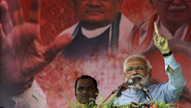 India's main opposition Bharatiya Janata Party's prime ministerial candidate, Narendra Modi, addresses his supporters during a campaign rally at Balasore, 124 miles (200 kilometers) from the eastern Indian city of Bhubaneswar, on April 11, 2014. (AP Photo/Biswaranjan Rout)