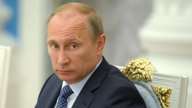Russia's President Vladimir Putin looks on as he chairs a meeting at the Kremlin in Moscow, on May 7, 2014. (AFP Photo/RIA Novosti/Pool/Alexey Druzhinin)