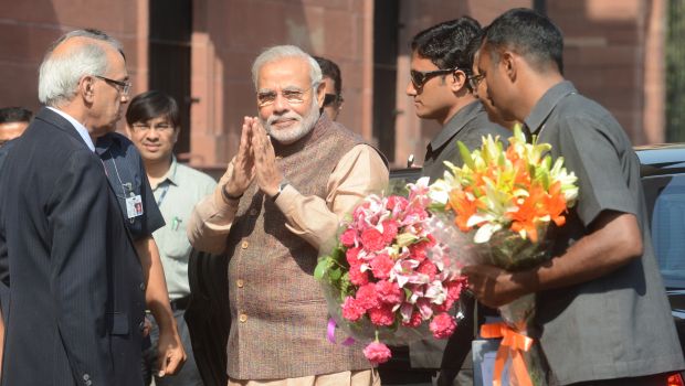 India’s new Prime Minister Narendra Modi (C) gestures during his arrival at the Prime Minister’s Office in New Delhi on May 27, 2014. (Raveendran/AFP/Getty Images)