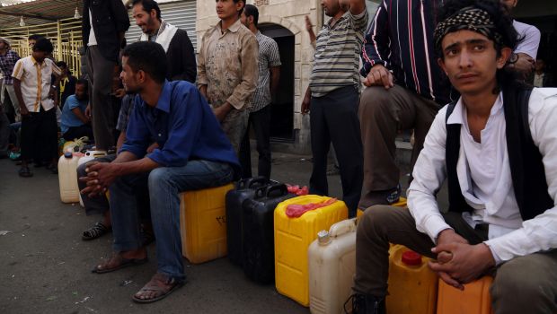 Yemenis queue to fill their jerrycans with gasoline at a gas station in Sana’a, Yemen, on May 13, 2014. (Sinan Yiter/Anadolu Agency/Getty Images)